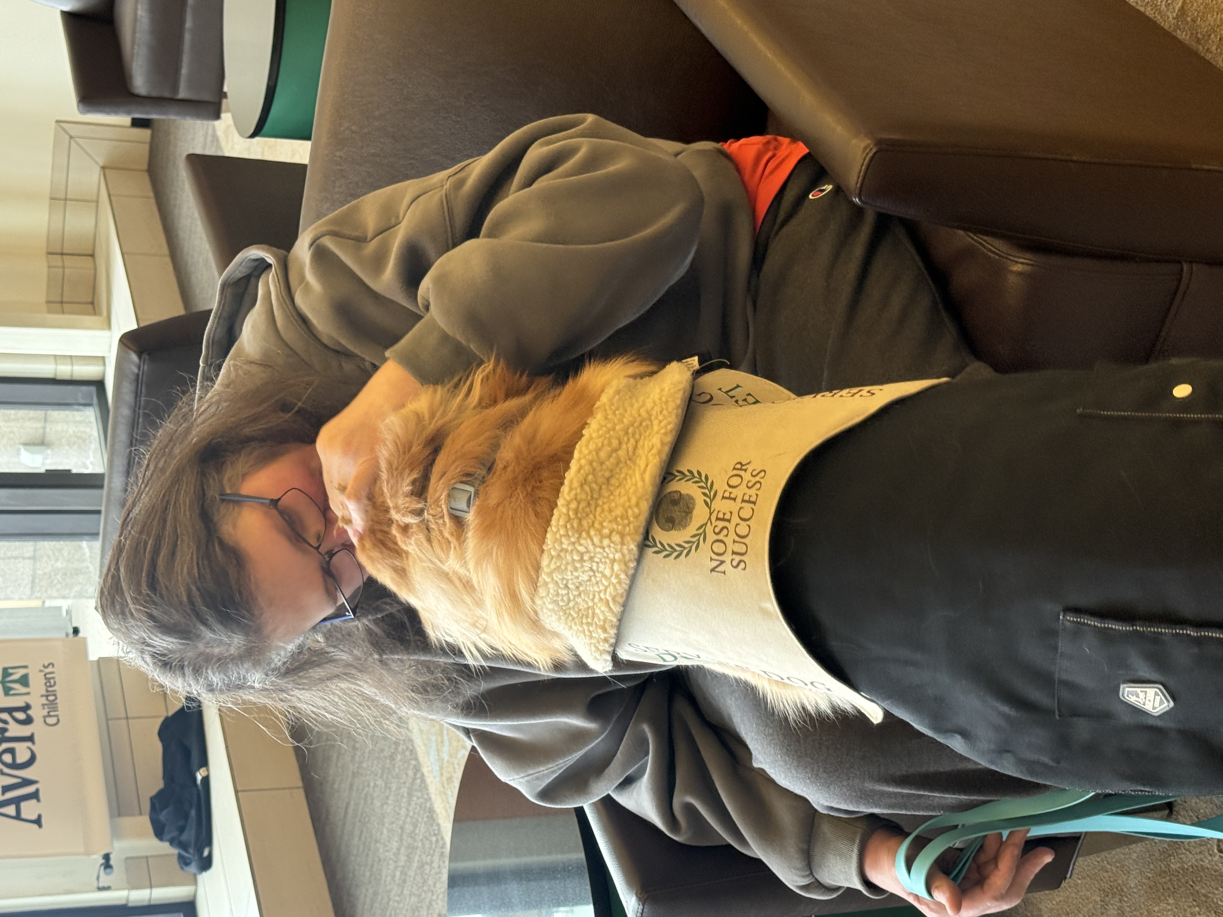 Handler embracing their service dog -- the bond that owner training builds